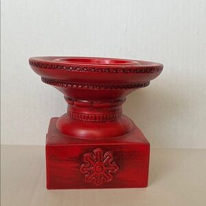 Red pillar ceramic candle holder.